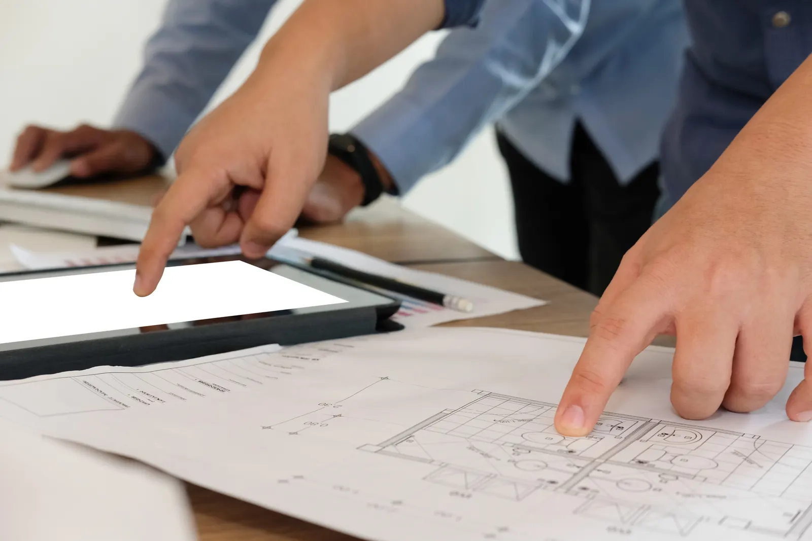 A contractor going over the plans for a project with a homeowner